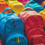 colorful backpacks piled together free