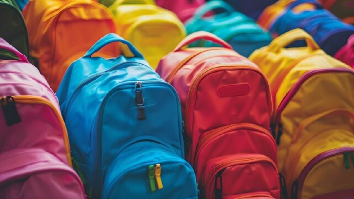 colorful backpacks piled together free